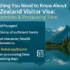 Infographic showing New Zealand visitor visa requirements and processing time for Dubai applicants, with scenic mountain lake in background.